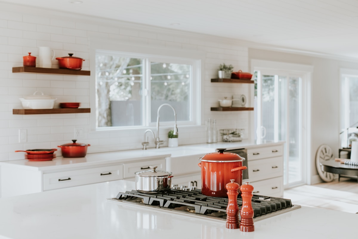Installed kitchen cabinets and storage with aligned doors and clean finishes