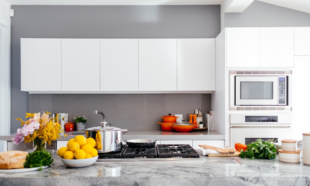 Updated kitchen remodel with cabinets, counters, sink, and modern fixtures